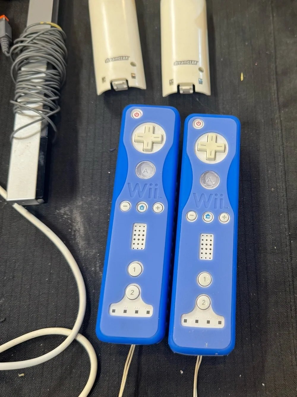 Nintendo White Wii Console with Blue Remotes and Blue Nunchuks